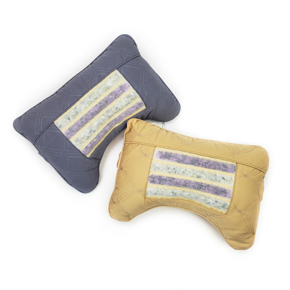 Two plush pillows on a white background, one gray and one beige, each featuring a rectangular, multicolored striped patch in the center. The Travel AJ Magnetic Pillow Firm InfraMat Pro® by HealthyLine is designed with a quilted finish for style and comfort as neck support pillows.
