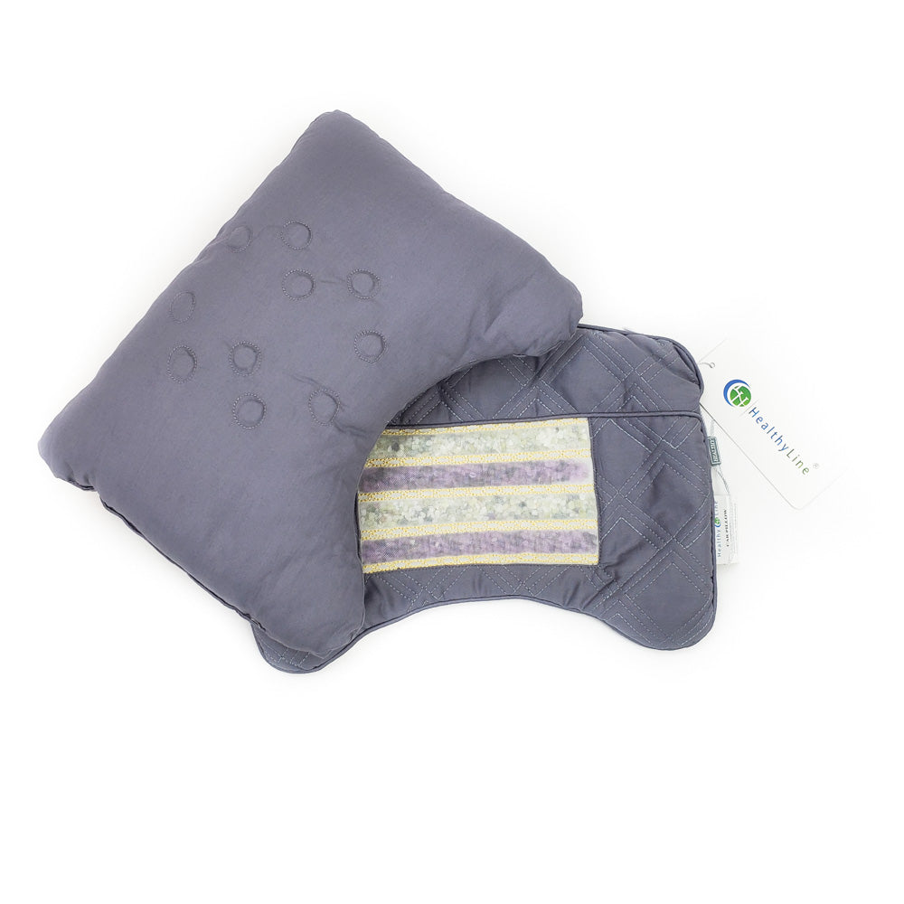 The Travel AJ Magnetic Pillow Firm InfraMat Pro® by HealthyLine is displayed on a white background. The gray neck support pillow with a quilted design features a tag showcasing the logo and text, as well as a removable section with striped fabric inside for enhanced travel comfort.