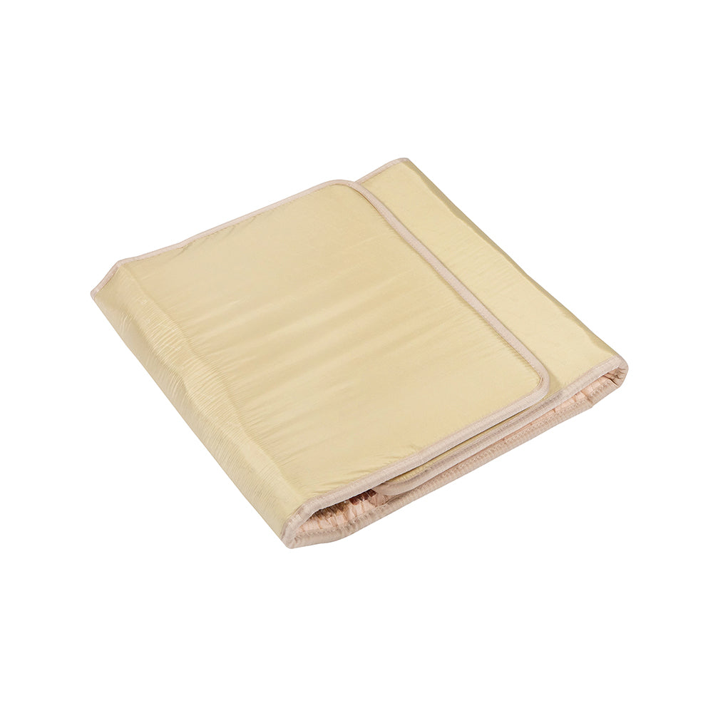 A folded beige Rainbow Chakra Mat™ Large 7428 Firm - PEMF Inframat Pro® Third Edition by HealthyLine, featuring a smooth texture and rounded edges, inspired by chakra harmony, displayed against a white background.