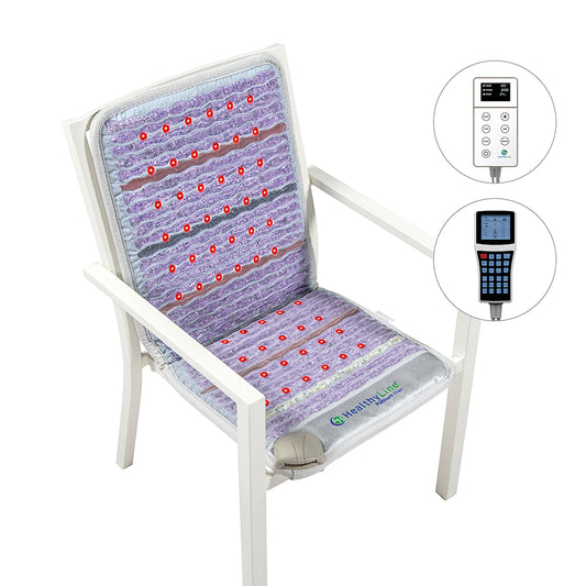 A HealthyLine Platinum-Mat™ InfraMat Pro® Chair 4018 Firm - Photon Advanced PEMF, showcasing a sleek white and purple design, is placed on a white chair and features numerous small red nodes. Experience the advantages of PEMF therapy with two remote controls having digital displays shown separately on the right side.