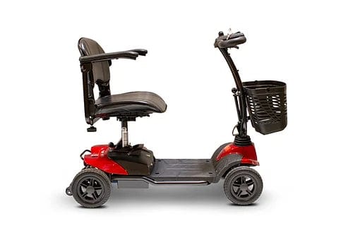The EW-M35 Power Scooter by E-Wheels is a red mobility scooter equipped with puncture-proof tires and four wheels. It features a black seat with armrests, a handlebar with controls, and a front-mounted basket, as well as a removable battery for added convenience. It is depicted from the side against a white background.