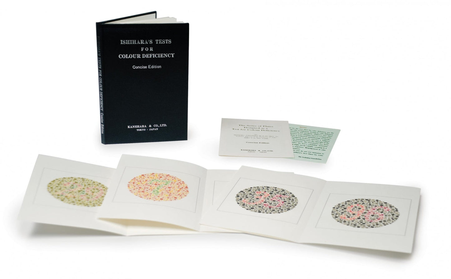 The Graham Field Ishihara Test Chart Books for Color Deficiency are shown open behind an unfolded color blindness test set, revealing dot pattern plates for detecting red-green deficiency. A visible card provides test instructions.