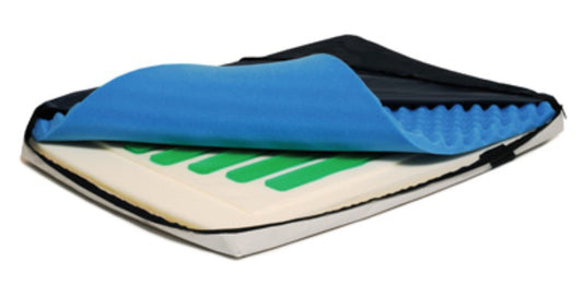 A partially opened Lumex Lightest Foam/Gel Overlay from Graham Field showcases its multi-layered design, featuring a black cover with a revealed visco-elastic blue top layer that has a textured surface alongside its green and white interior. It is crafted for optimal pressure management, offering unmatched comfort and support.