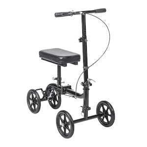 The Drive Medical Knee Walker Economy Folding RTL BX features four wheels, a padded knee rest, handlebars, and a brake cable to enhance mobility during recovery from lower leg injuries.