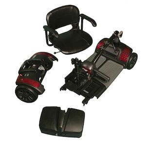 The Drive Medical Power Scooter Spitfire Pro 17" 4 Wheel disassembles into a black seat, two durable red and black wheel sections, a sturdy base platform, and a battery cover. This scooter combines style with reliable mobility.