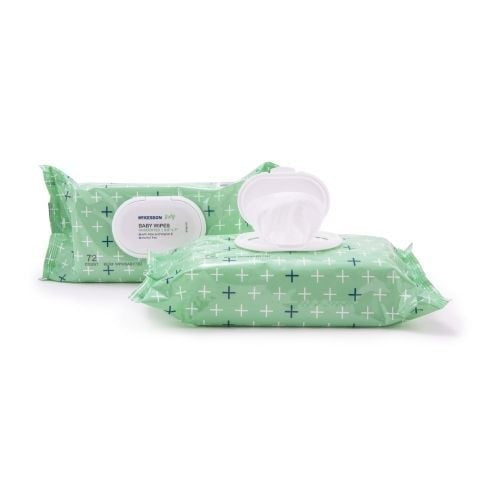 Two packs of McKesson Baby Wipes with Aloe and Vitamin E in green packaging featuring a white cross pattern. One pack is sealed, while the other is open, displaying some of the gentle wipes ideal for sensitive skin.
