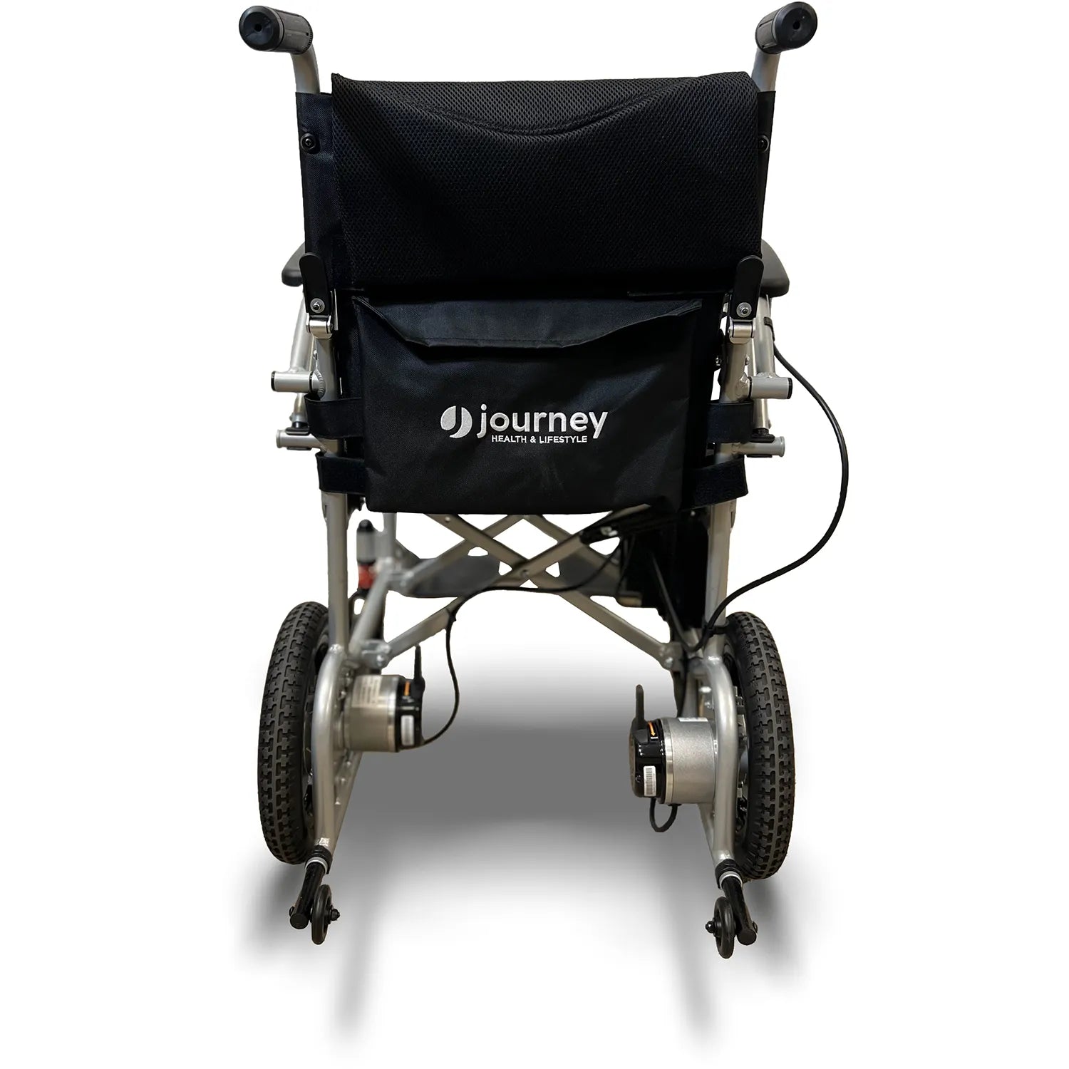 Rear view of the Journey Air Power Wheelchair by Journey Health & Life Style, a black and silver foldable model with large rear wheels, small front wheels, and a black storage pouch on the backrest.