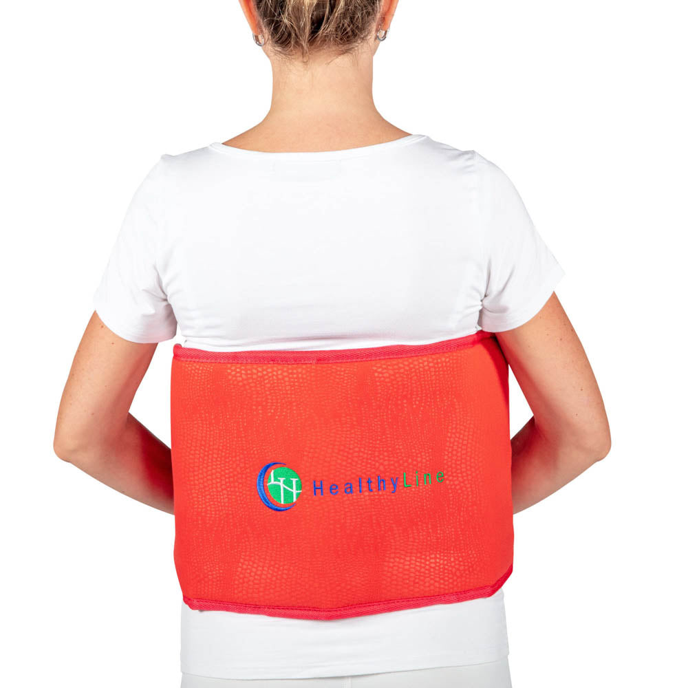 A person is wearing the HealthyLine Amethyst Belt Soft - Photon PEMF InfraMat Pro® with their back to the camera. The belt, which showcases PEMF therapy, is red and displayed over a white shirt.