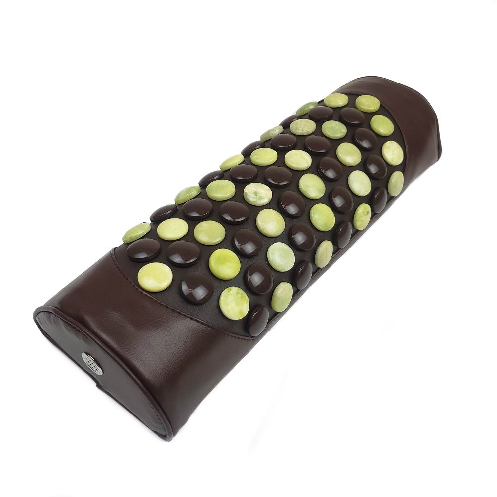 The Pebble JT Bolster Firm InfraMat Pro® by HealthyLine is a firm brown pillow embellished with rows of polished jade and tourmaline gemstones. These stones are symmetrically arranged to distribute far-infrared rays evenly across the surface, providing a soothing experience.