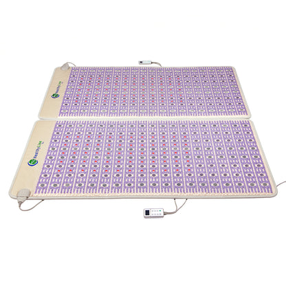 Two beige TAJ-Mat™ King 8076 Firm - Photon PEMF Split Inframat Pro® mats from HealthyLine, adorned with purple and pink geometric patterns, are placed side by side. Each mat is equipped with a remote control connected by a wire for easy adjustments. The HealthyLine brand logo is prominently displayed in the top left corner of each mat.