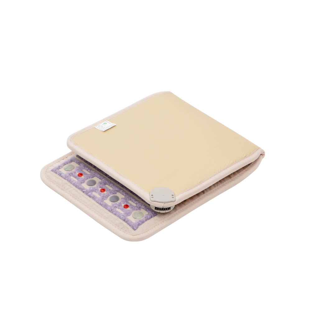 The TAJ-Mat™ Chair 4018 Firm - Photon PEMF InfraMat Pro® by HealthLine is an open beige and purple massage pillow that reveals its inner side adorned with textured stones, providing natural therapies perfect for alleviating back pain.