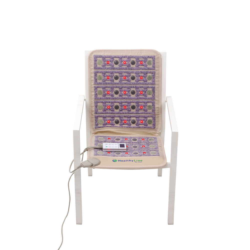The TAJ-Mat™ Chair 4018 Firm - Photon PEMF InfraMat Pro® by HealthLine is a white chair designed with a padded seat and back cushion to help alleviate back pain using natural therapies. It incorporates multiple embedded stones and comes with a control device connected via a cable, offering potential therapeutic or heating benefits.