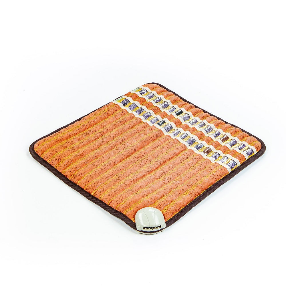 The TAO-Mat® Small 1818 Soft InfraMat Pro® by HealthLine, displayed on a white background, showcases a square orange design with dark edges. It provides heat therapy through its textured surface and includes an attached control unit in the bottom corner, featuring crushed natural gemstones for enhanced relaxation.