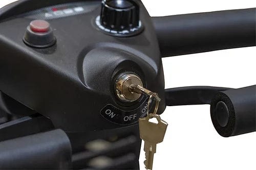 A close-up of the EW-M39 Power Scooter by E-Wheels showcases its ignition with a key inserted, featuring "ON" and "OFF" settings. The control panel includes a red button and black knob, enhancing wireless design, while the powerful battery ensures efficiency and part of the handlebar is visible.