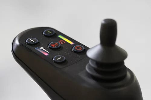 Close-up of the joystick controller for the EW-M45 Portable Power Wheelchair by E-Wheels, featuring multiple buttons and an LED display. The black joystick is highlighted, with buttons marked by symbols such as plus and minus signs, along with a colored strip to indicate power levels.