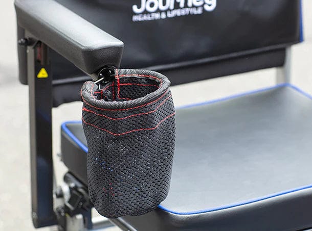 A black mesh cup holder with red stitching is attached to the armrest of a So Lite Scooter by Journey Health & Life Style, highlighting its lightweight design. The seat and backrest feature the Journey logo.