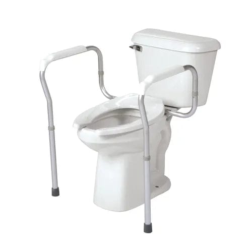 The Direct Supply Toilet Safety Frame, available in white, features an adjustable design with a silver frame on each side. The aluminum tubing is equipped with black rubber tips at the bottom, ensuring stability and providing reliable assistance for users.