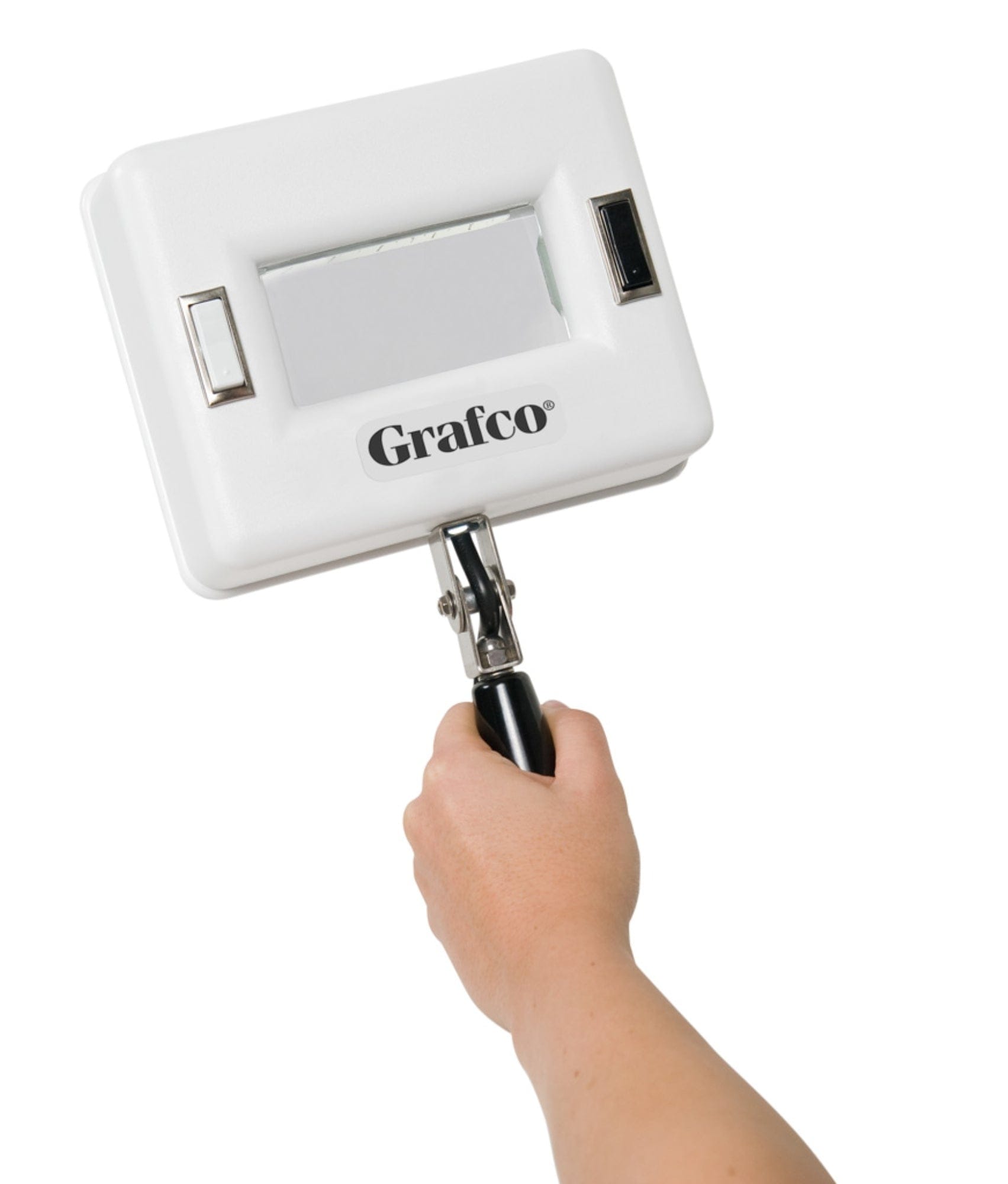 A hand holds a Graham Field Q-Series UV Magnifier Hand Held Woods Exam Lamp, featuring a portable design with a rectangular light panel and reflective handle. Ideal for medical or inspection purposes, it provides focused illumination, perfect for fluorescence analysis.