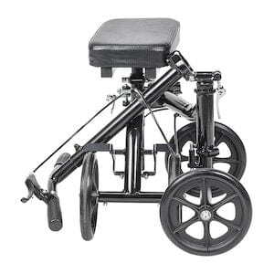 The Drive Medical Knee Walker Economy Folding RTL BX features four wheels and a padded knee rest, shown folded for easy transport or storage—ideal for enhancing mobility during recovery.